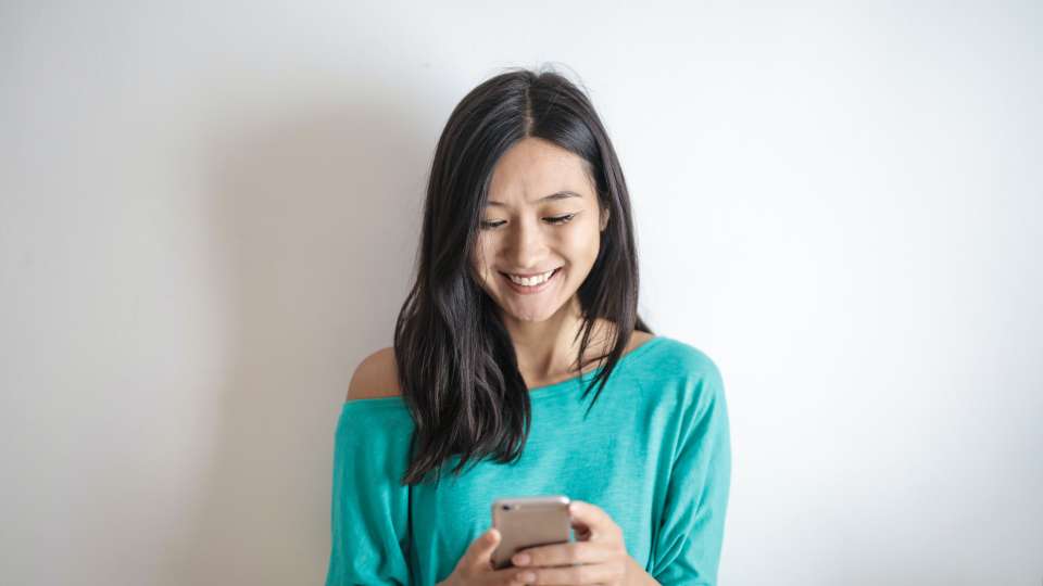 young woman looking at her phone